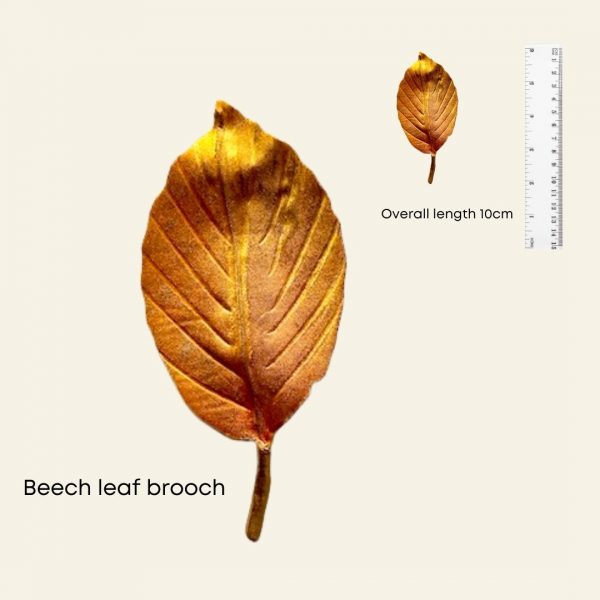 Handmade beech leaf brooch with ruler to indicate size
