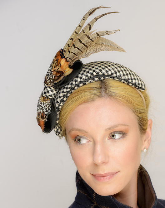 Close-up of Border tartan headpiece with pheasant trim.