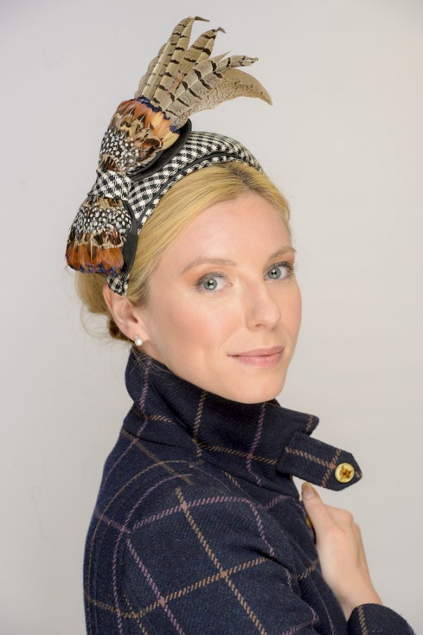 Detail of Border tartan headpiece with pheasant trim.