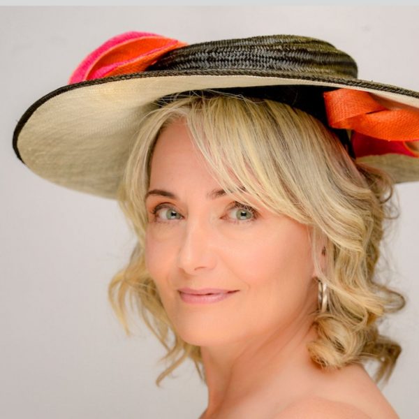 Black buntal brimmed hat with ivory underlay and orange and pink twists - side