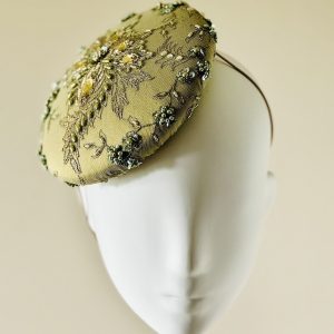 Emily - a mid size perching beanie style headpiece in chartreuse coloured jewelled lace - front view