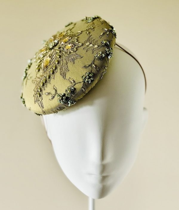 Emily - a mid size perching beanie style headpiece in chartreuse coloured jewelled lace - front view