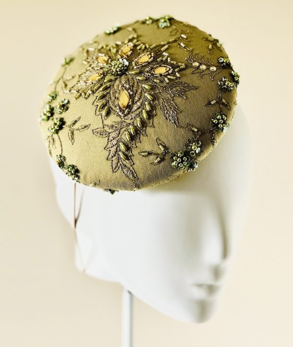 Emily - a mid size perching beanie style headpiece in chartreuse coloured jewelled lace - left view