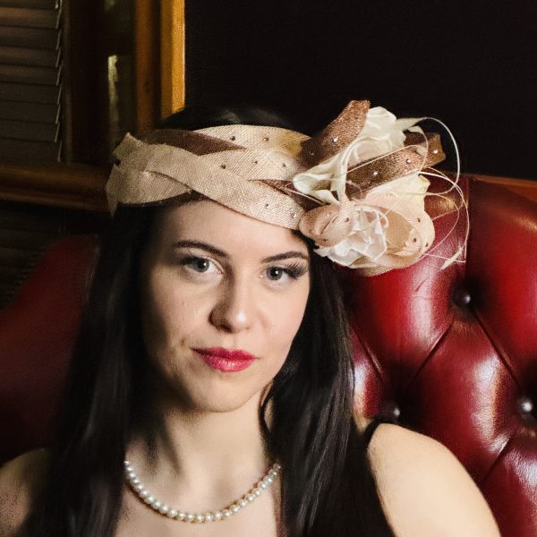 Evie – 20’s inspired sinamay plaited headband with cotton organdie flowers pictured facing